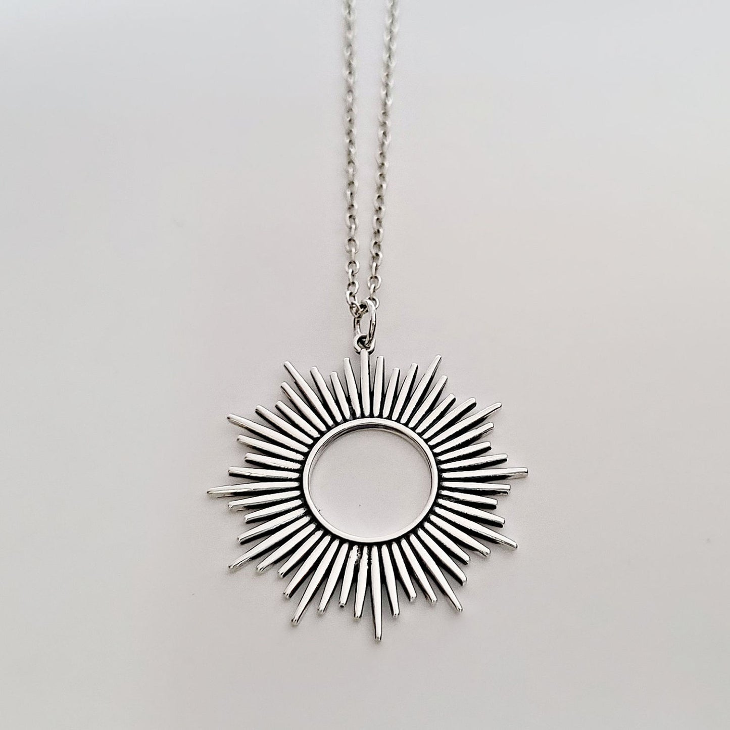 Sterling Silver Spikey Sunburst Pendant -- EF0181